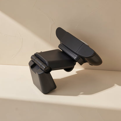Talklens – Webcam folded and tilted at an angle on its hinged stand, showing the joint, against a textured wall