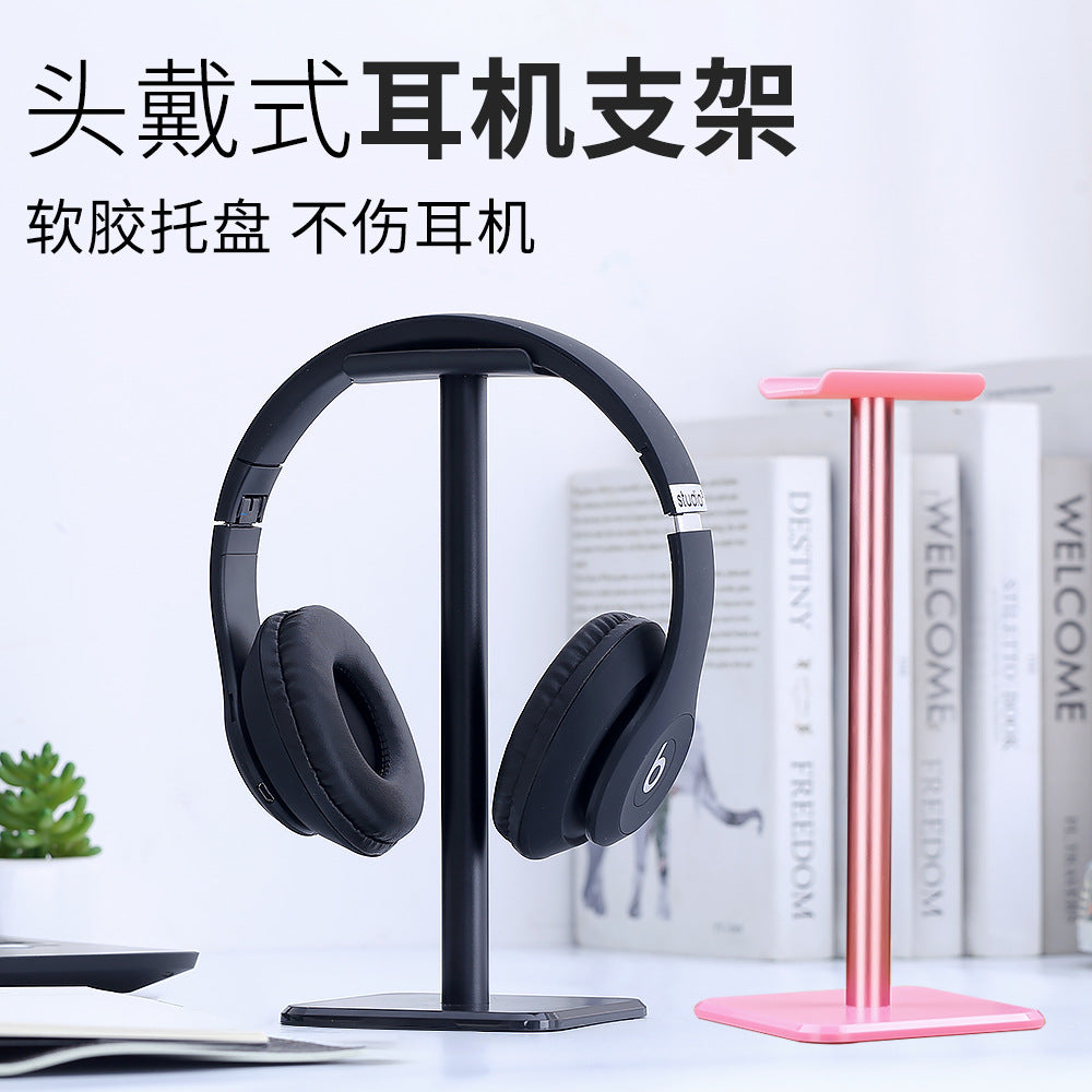 Cranio Aluminum Headset Holder with black over-ear headphones, next to a pink one, with Chinese text overhead