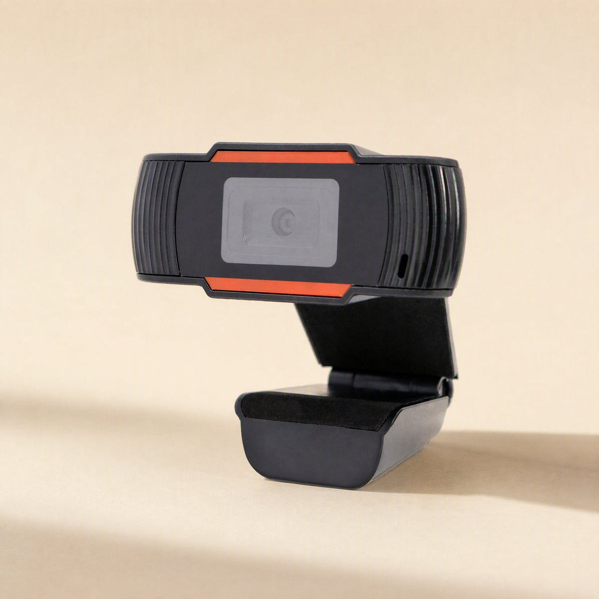 Clearcam 720P USB Computer Camera in black with orange accents, angled front view on a beige background