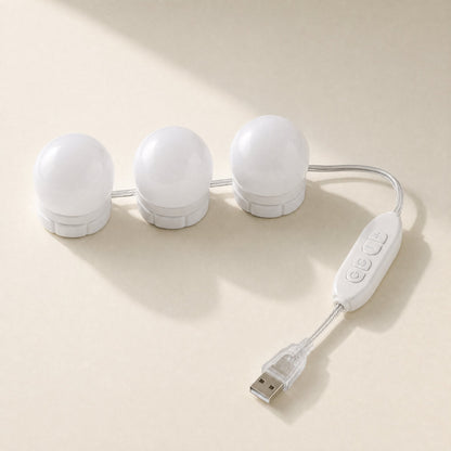 Deskbeam – Three white round vanity-style bulbs on a clear USB cable with a touch control switch