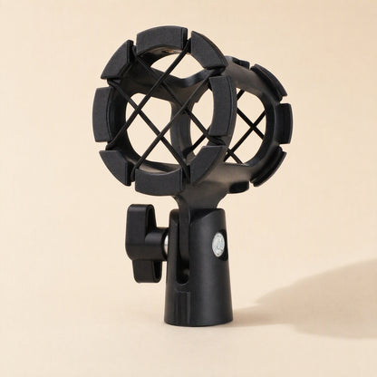 Miccushion – Rear view of the black mic holder showing the clamp screw, padded cradle and silver base screw