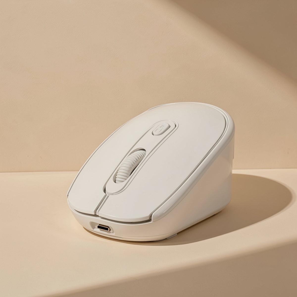 Opticlick – Cream white wireless mouse at a three-quarter angle showing the scroll wheel and USB-C charging port