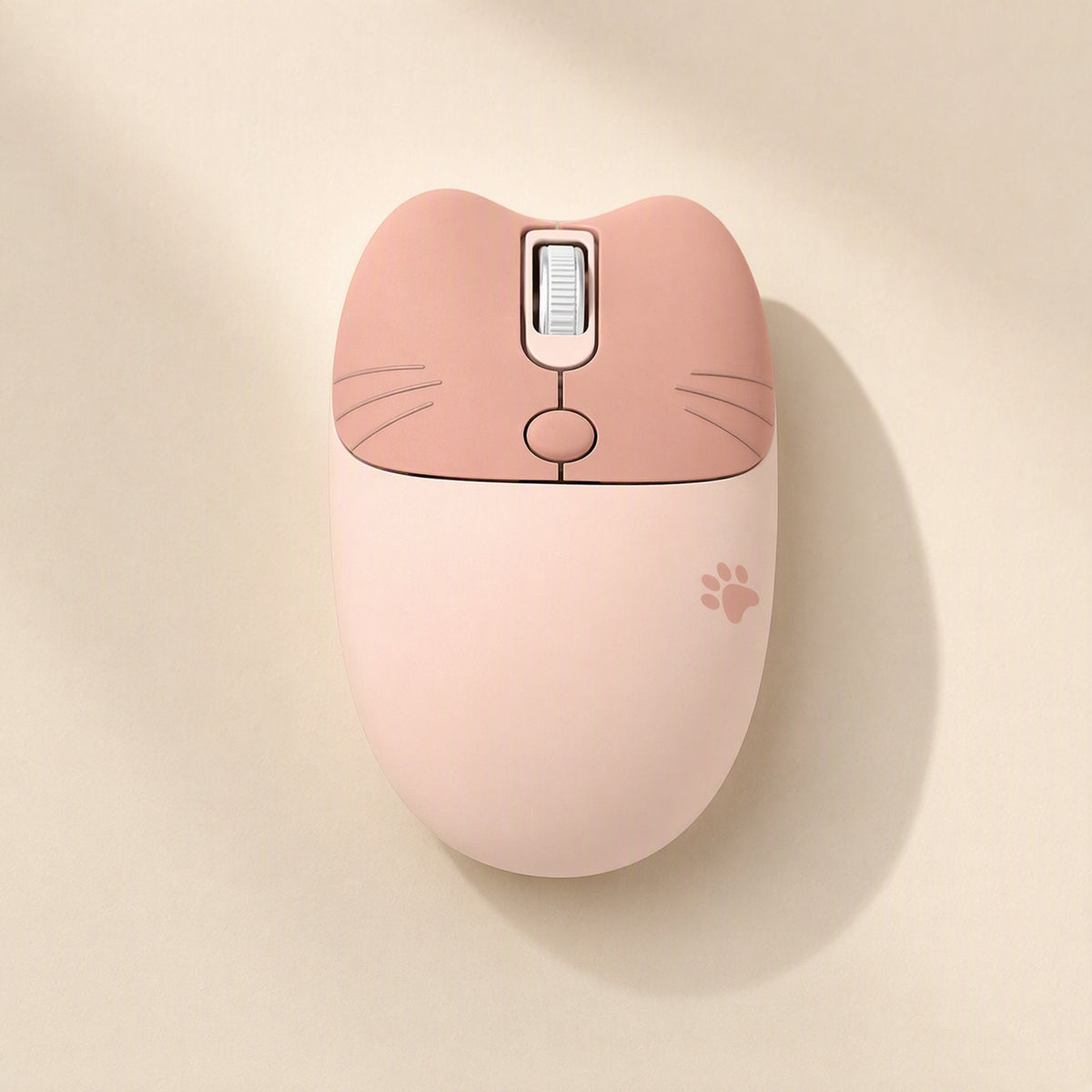 Triclick – Top-down view of a peach and light pink wireless mouse with cat whiskers and a small paw print