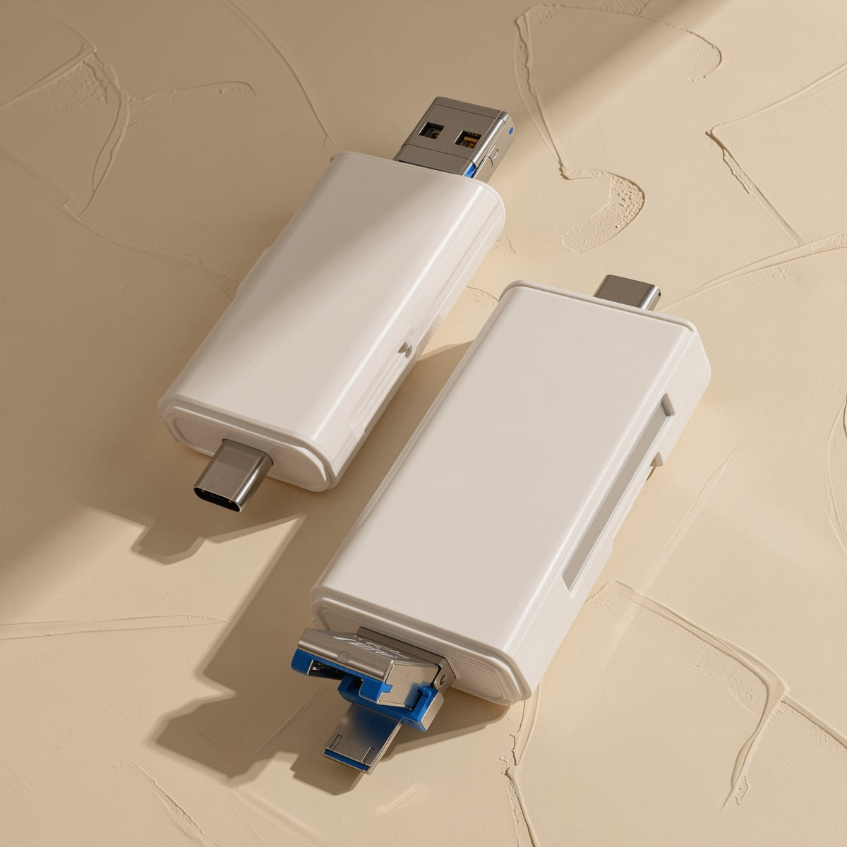 Sixport – Two white card readers side by side, one showing a USB-A plug and the other with Type-C and blue connectors