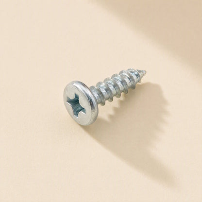 Microbite – Close-up of a single zinc-plated cross-head self-tapping screw with a rounded head, lying on its side