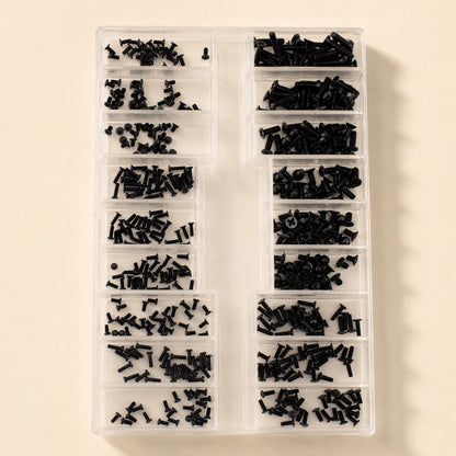 Microbite – Overhead view of a clear divided organizer filled with small black screws sorted into many compartments