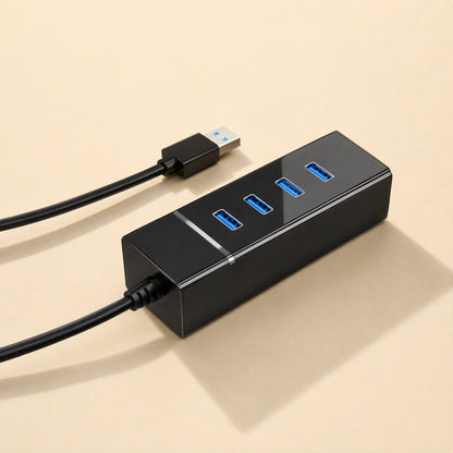 Databranch – Black USB hub seen from the cable side, four blue ports in a row and a silver accent line