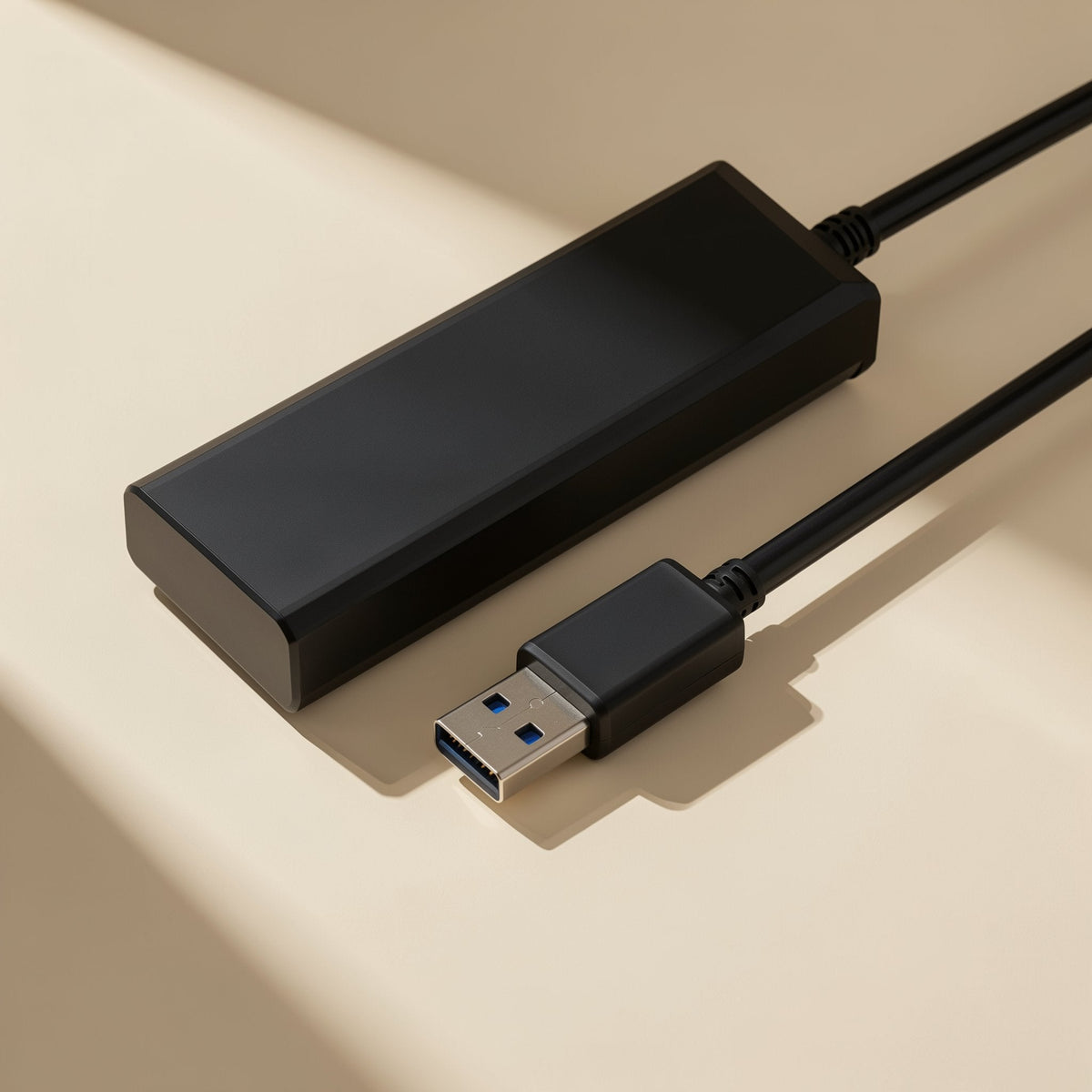 Portsplit USB Hub 4-Port USB 2.0 Splitter in black, shown from above with its USB plug and cable in angled light