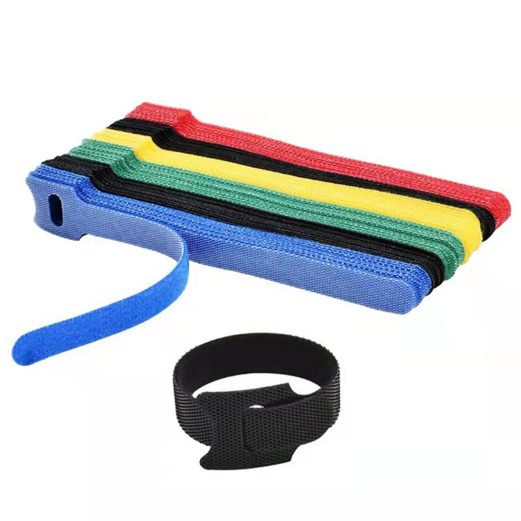 Catstrap – Stack of multicolored hook and loop straps with one blue strap pulled out and a black strap looped below