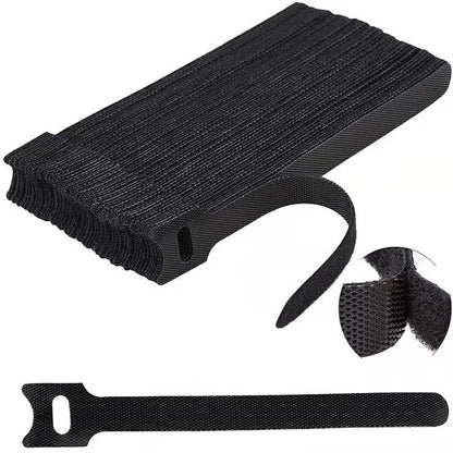 Catstrap – Black T-shaped straps stacked in a pile with a close-up of the hook and loop surface and one strap below