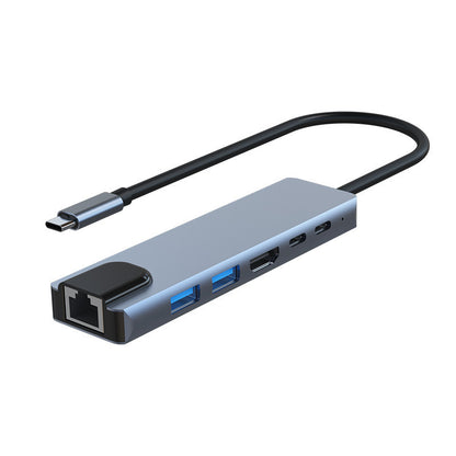 Dockport – Angled view of the gray docking hub showing its RJ45 port, two blue USB ports, HDMI port and two USB-C ports