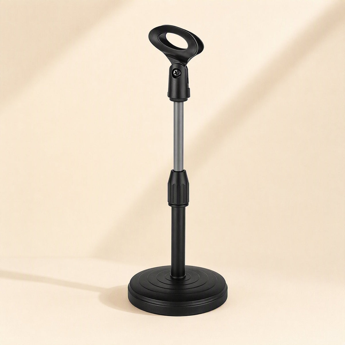 Voicelift – Black telescopic desktop stand with oval clip and extendable silver rod on a round weighted base