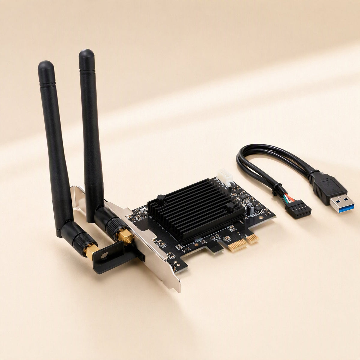Twinsignal – PCIe wireless card with heatsink, two screw-on antennas, bracket and a USB cable with header connector
