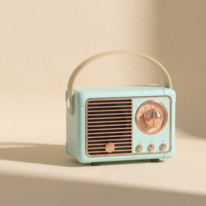 Oldchime – Mint green retro speaker with rose gold dial and grille, three-quarter angle against a cream wall