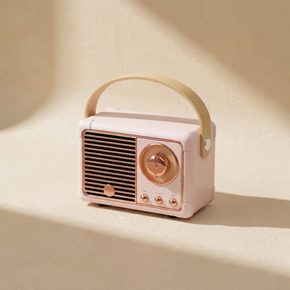 Oldchime – Pink vintage-style speaker with a cream handle, angled view showing the copper knob and three buttons