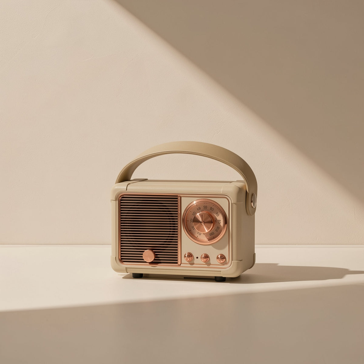 Oldchime Retro Bluetooth Speaker – beige retro radio-style speaker with copper dial and grille, side-lit on a pale tabletop