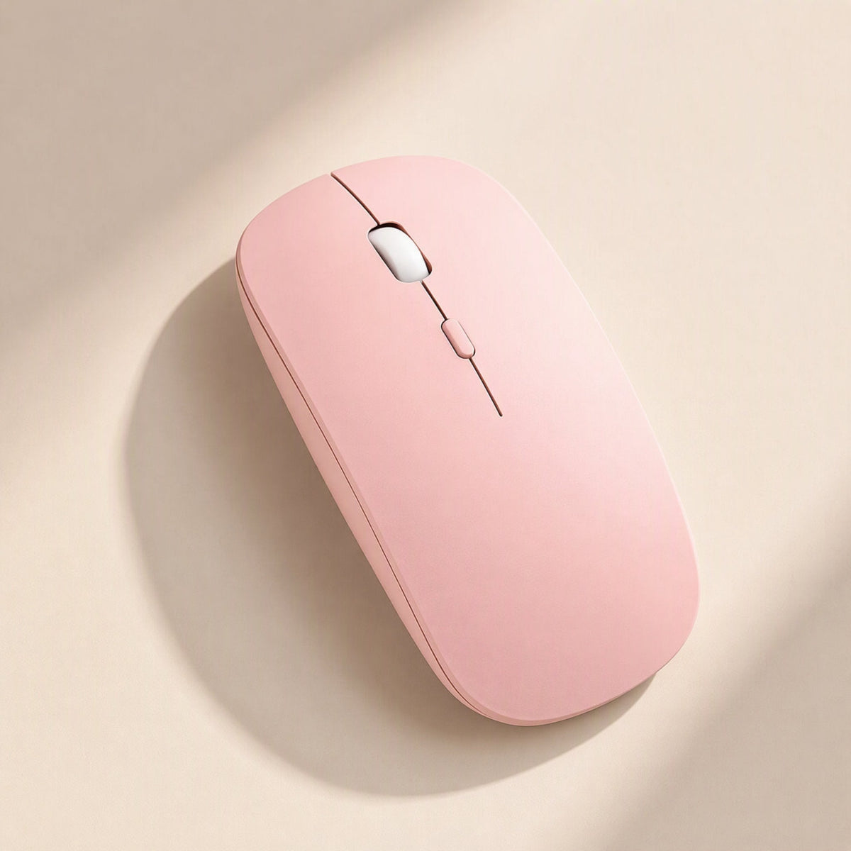 Freemove 2.4GHz Wireless Mouse – pink matte wireless mouse with white scroll wheel and slim profile on a cream background