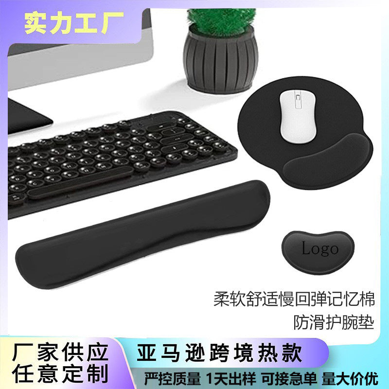 Foamwell Memory Foam Wrist Mouse Pad set in black beside a keyboard, with mouse pad, wrist rest and logo pad