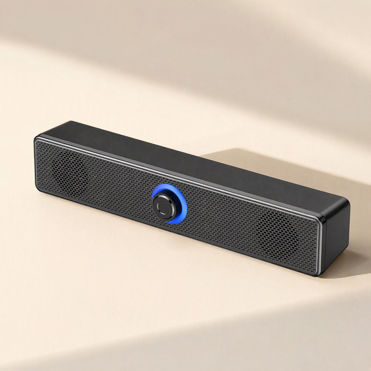Clearbeat – Front view of black mesh-grille speaker bar with glowing blue ring around central knob