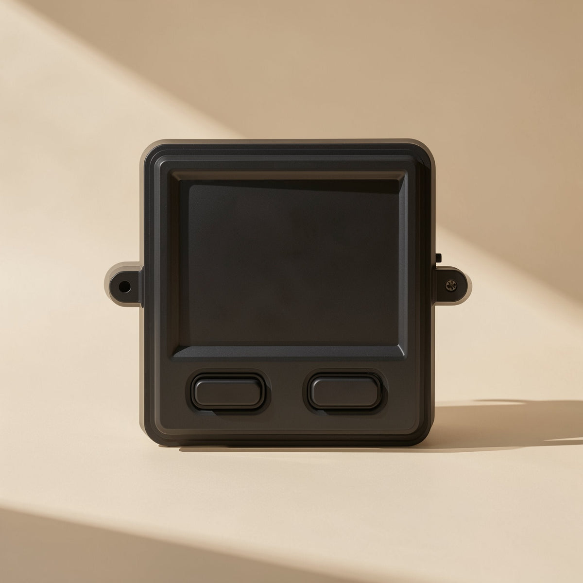 Workclick – Black industrial touchpad mouse with two buttons and screw-hole mounting ears, front view in soft sunlight