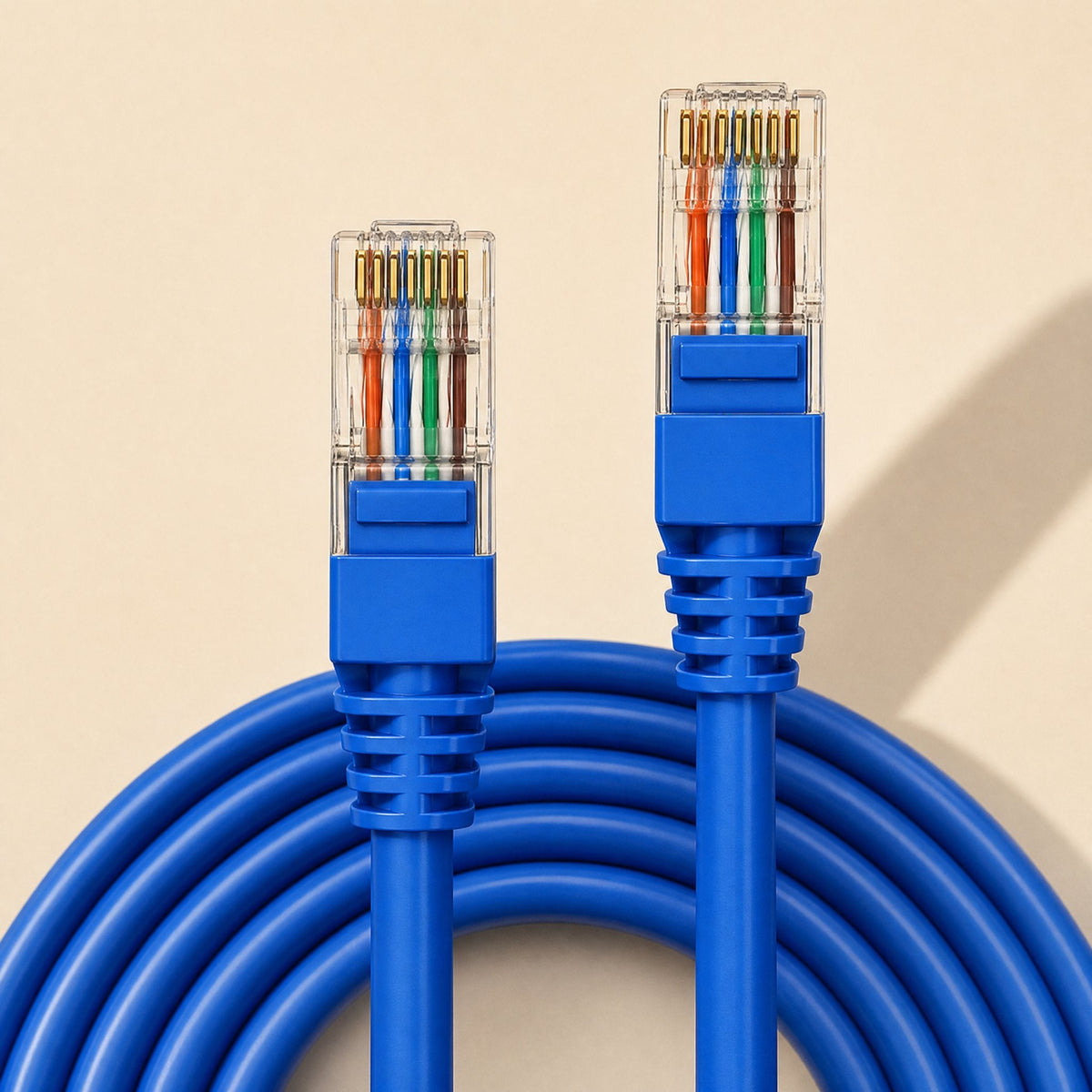 Linkpath – Straight-on view of two blue RJ-45 plugs with orange, blue, green and brown wires above a looped cable