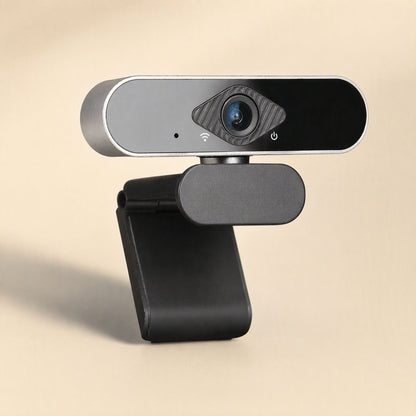 Faceview USB Computer Camera angled three-quarter view on a black clip stand against a beige backdrop