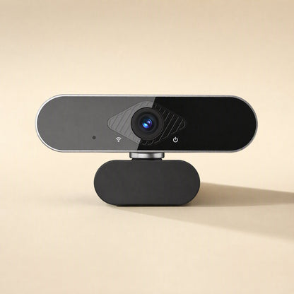Faceview – Straight-on view of the webcam showing its glossy black face, silver rim, microphone dot and Wi-Fi style icon