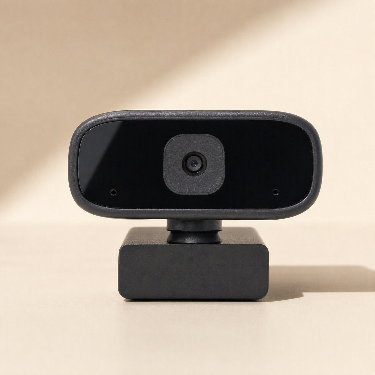 Voiceview USB Computer Camera With Microphone in black, front view on a beige background