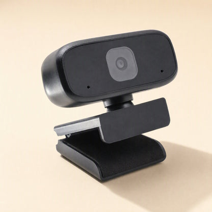 Voiceview – Rear-right angle of the black webcam showing its hinged clip and soft base pad