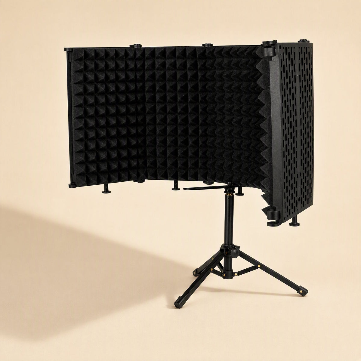 Soundcove Microphone Sound Insulation Cover on a small tripod stand, angled view with foam panels unfolded