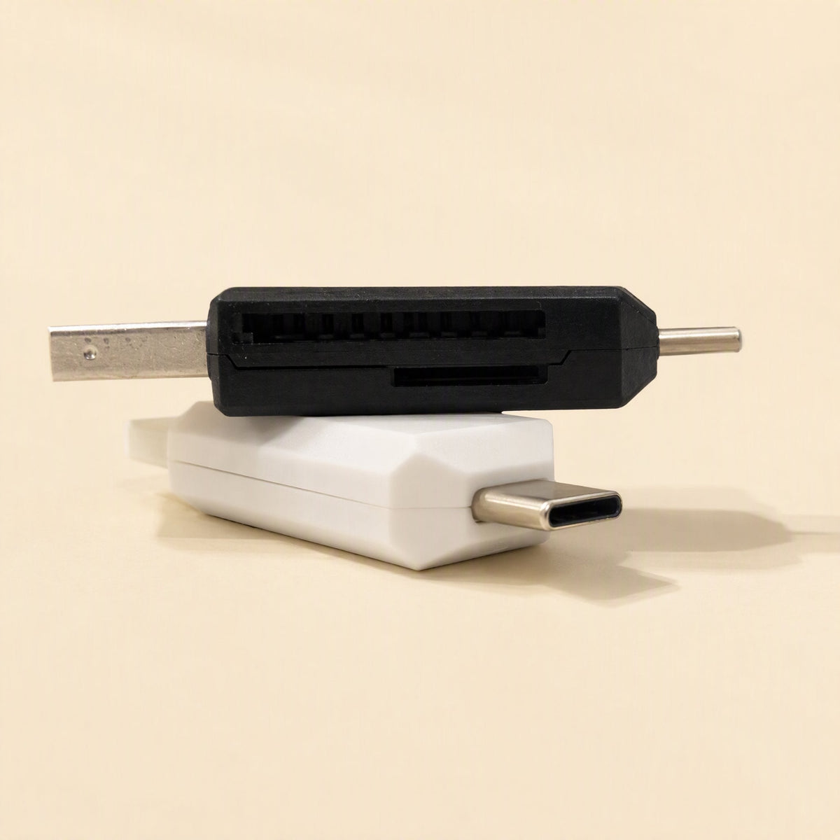 Slotbridge Type-C SD TF Card Reader – black reader resting on a white one, close view of the slots and the USB-C plug