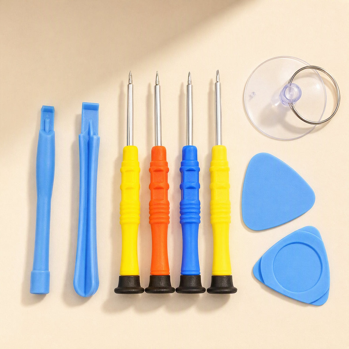 Bitfix – Four yellow, orange and blue screwdrivers with black caps beside blue pry tools, picks and suction cup