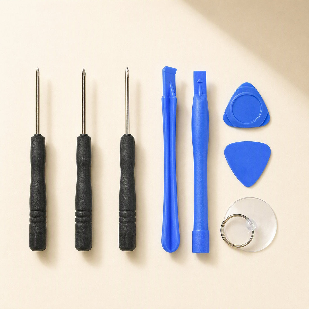 Bitfix – Three black-handled screwdrivers, two blue pry tools, two picks and a suction cup in a row