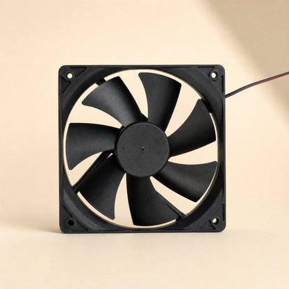 Breezeball – Straight-on view of the black square frame, blades and round hub, with the wire at the top right