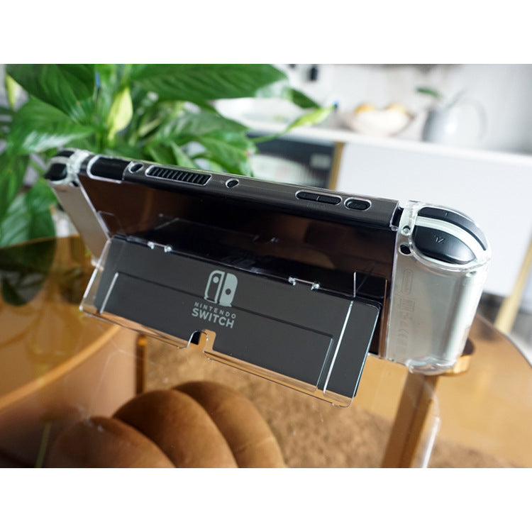 Frameclad Switch OLED Split Protective Case on a console standing upright on a glass table beside a plant