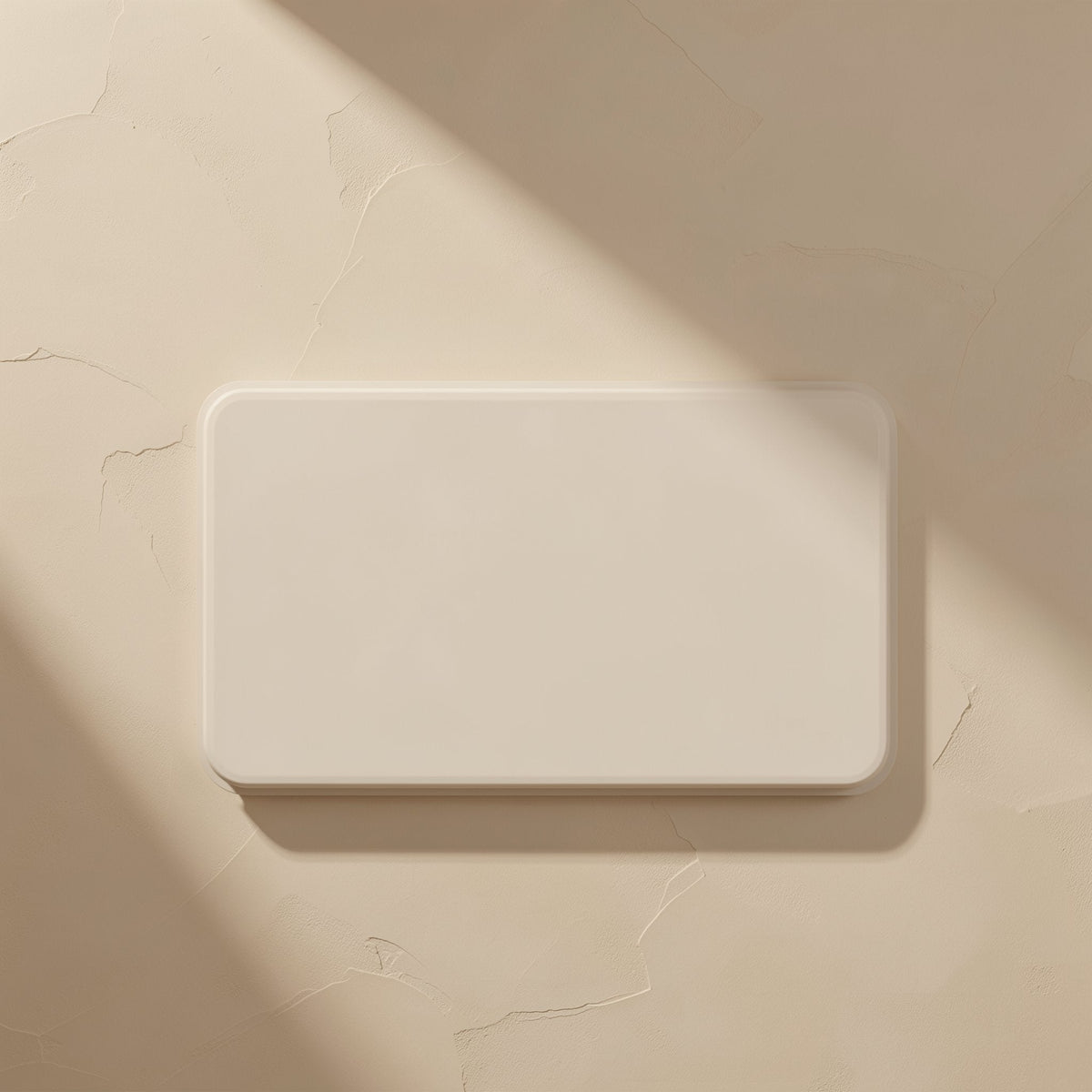 Typehub Type-C SD TF Card Reader – blank rounded rectangle on a cracked beige plaster surface with a diagonal shadow