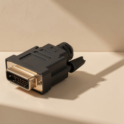 Viewlink – Close-up of the black DVI connector with gold-toned shell, pins and thumbscrew on a beige surface