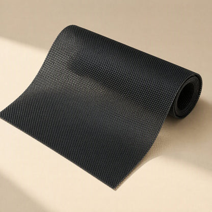 Dustveil Computer Case Dust Net – black PVC mesh dust net partly unrolled, showing the fine, even weave and curled edge