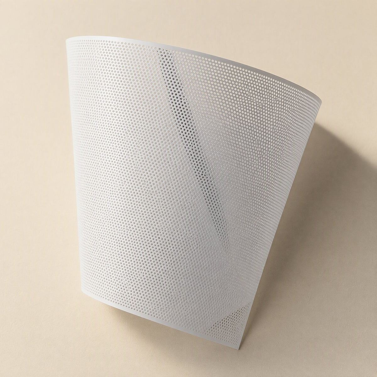 Dustveil Computer Case Dust Net – white perforated mesh sheet curved upright, showing the dense grid of small holes