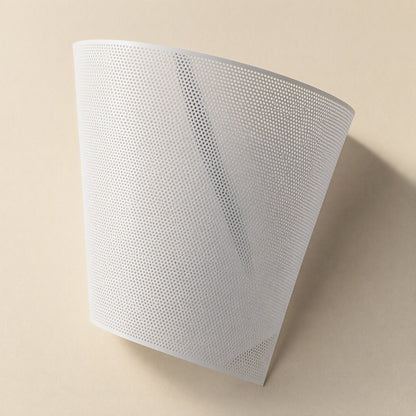 Dustveil Computer Case Dust Net – white perforated mesh sheet curved upright, showing the dense grid of small holes
