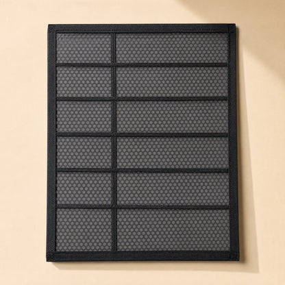 Dustveil – Black framed dust filter panel with a honeycomb mesh and horizontal bars, seen from the front