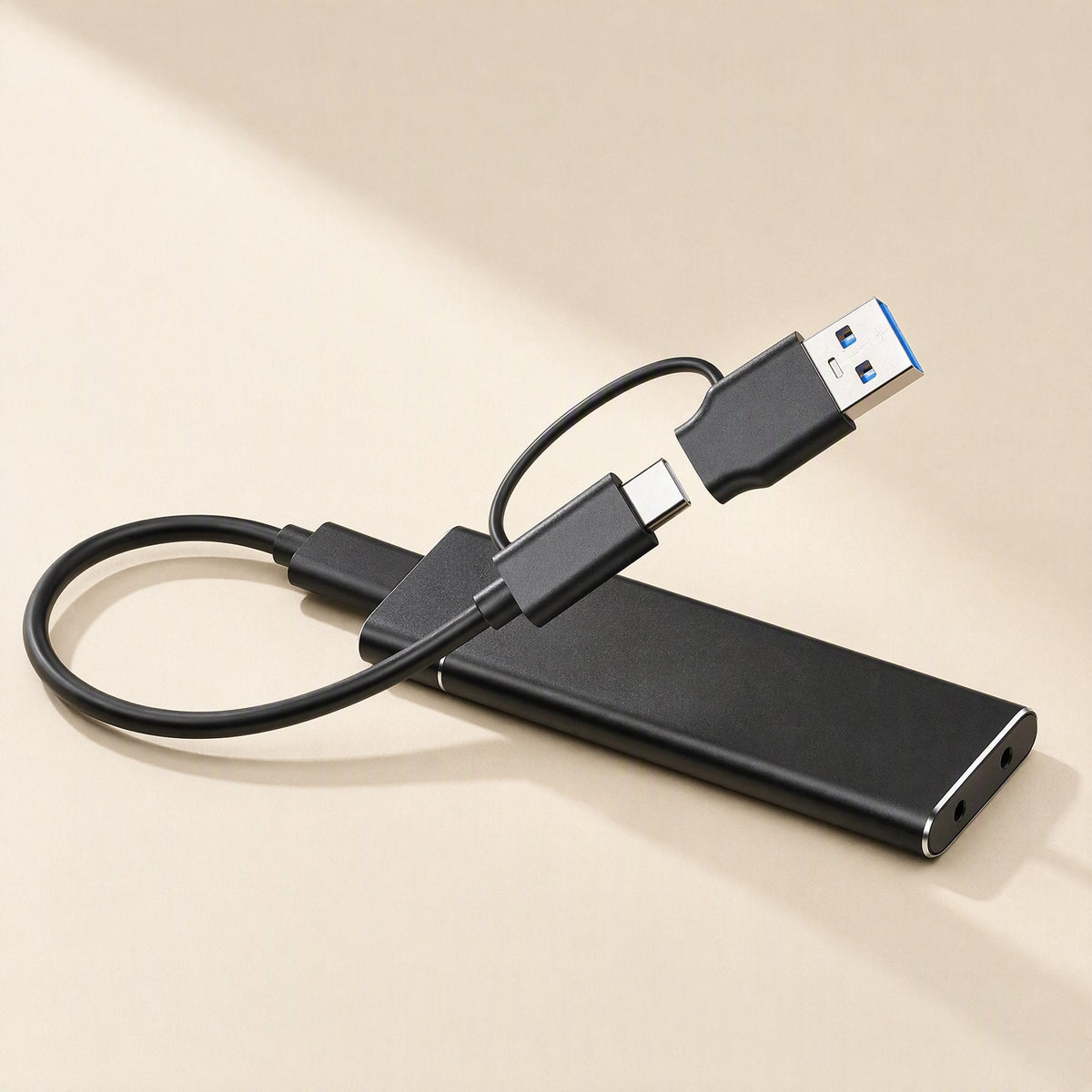 Alloydock M.2 SSD Enclosure – black enclosure with a USB-C cable and a detachable USB-A adapter resting on top