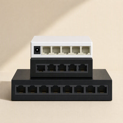 Deskport Desktop Network Switch in white and black, stacked three high, ports facing front