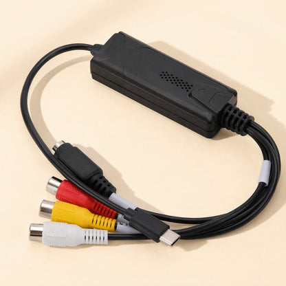 Streamport – Underside of the capture card housing with vent holes, RCA and S-Video jacks, and USB-C plug at the front