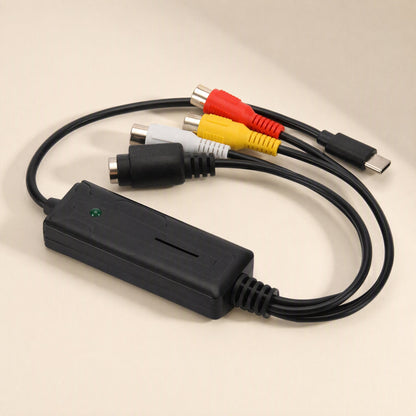 Streamport – Capture card with looped black cables, green indicator light, and S-Video and RCA ports at the top, side view