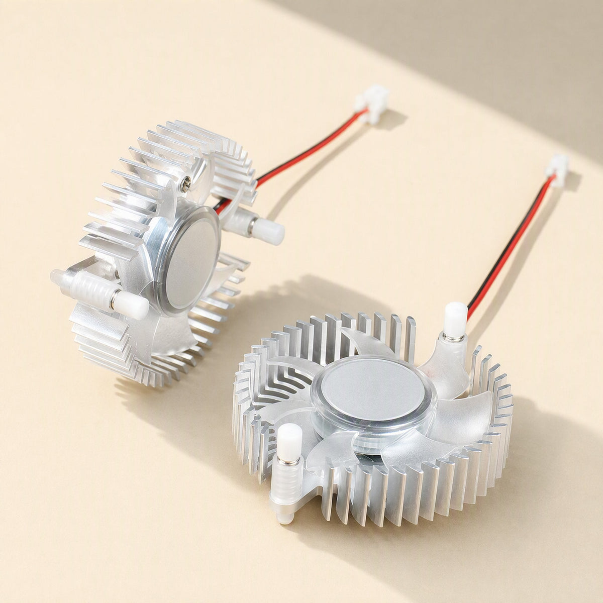 Cardcool 55mm Aluminum Graphics Card Radiator, two silver fan heatsinks with red and black wires on beige