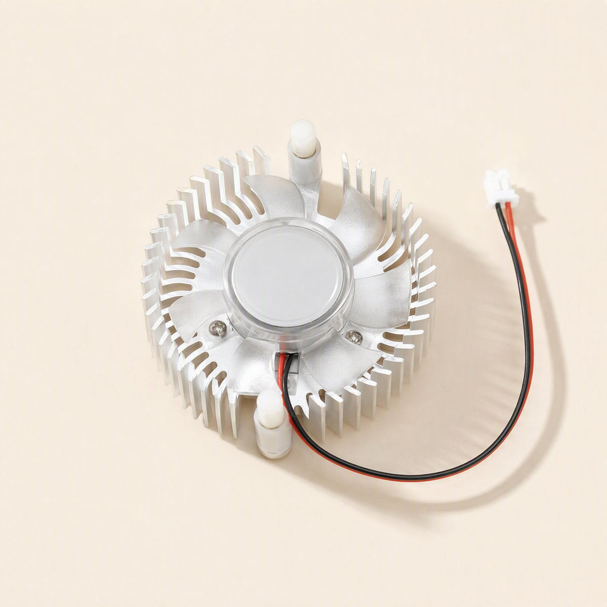 Cardcool – Overhead view of the radiator with fan wire coiled to a small white two-pin connector