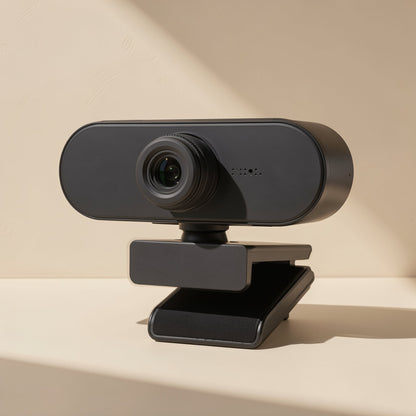 Lenslook – Front three-quarter view of the black webcam, with a small microphone detail and a padded clip underneath