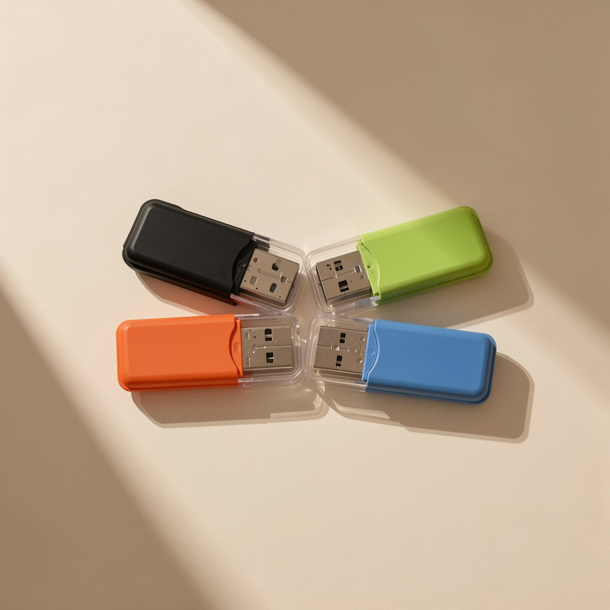 Chipread USB-A TF Card Reader in black, green, orange and blue, laid out in a cross on a beige surface