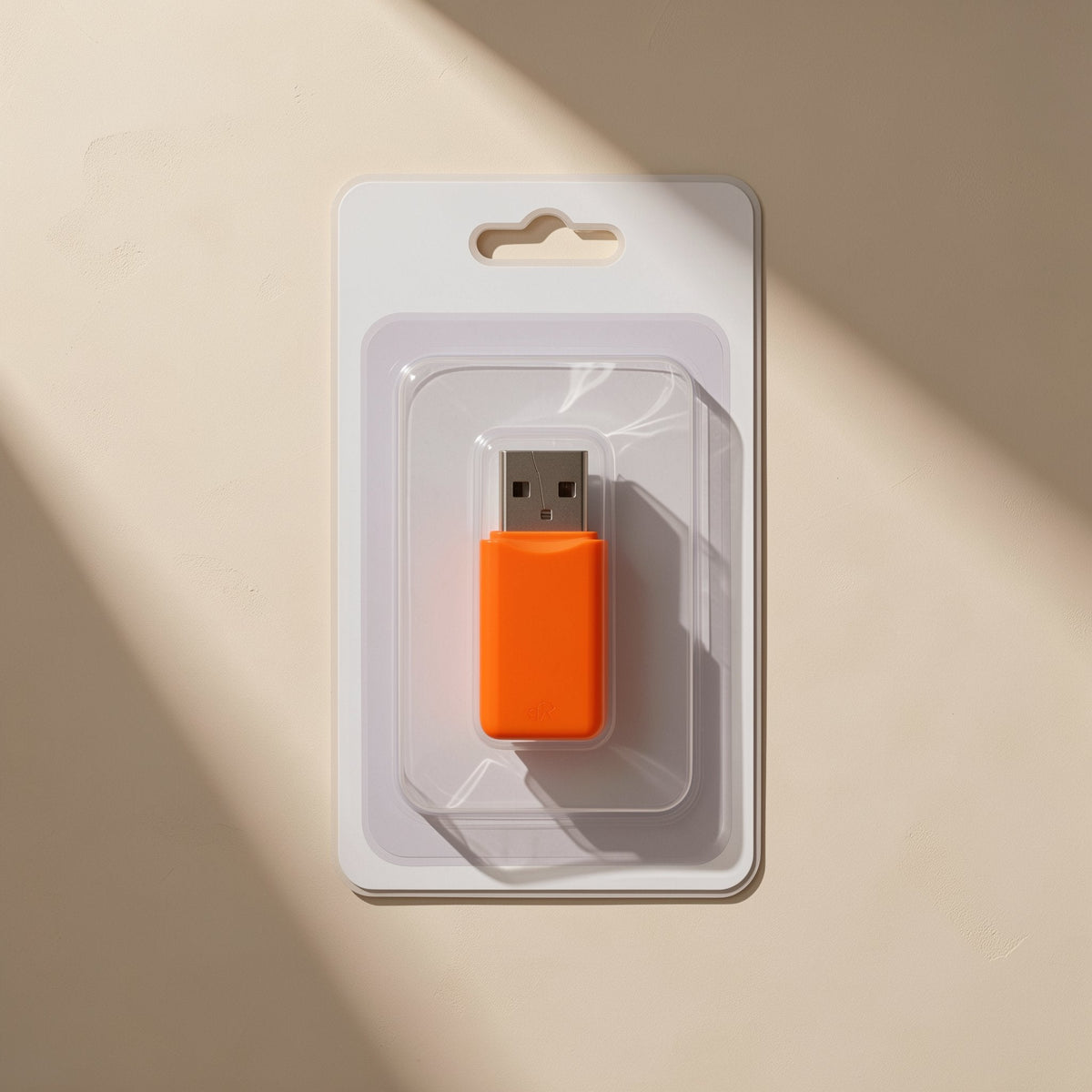 Chipread – Orange USB card reader sealed in a clear plastic blister pack on white card backing with a hanging slot